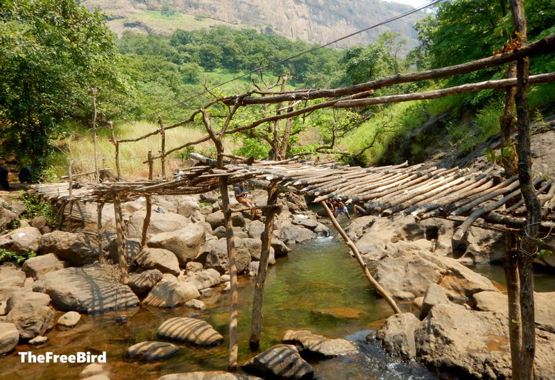 wooden brridge devkund waterfall 