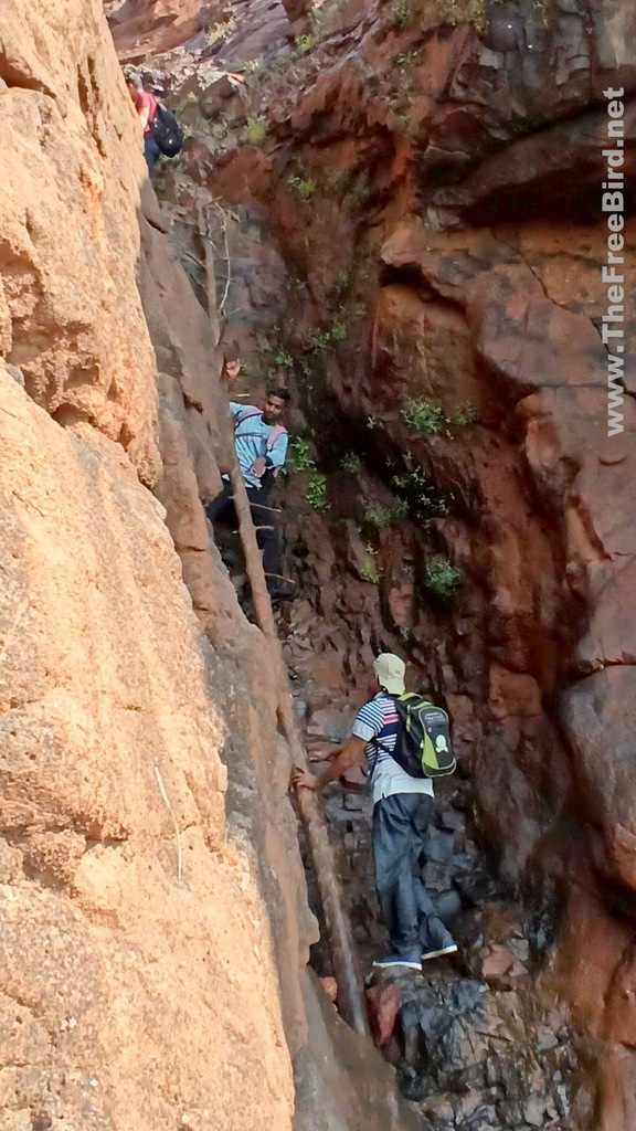 climbing ladder on pisarnath route to Matheran