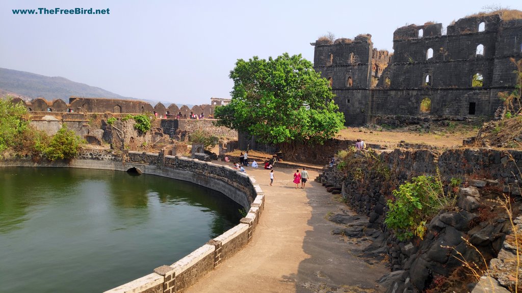 Fresh water circle lake at Murud Janjira fort with 4 storey building