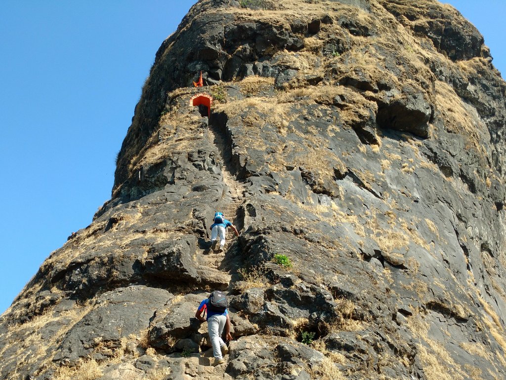 Climbing the vertical stairs of Harihar fort trek
